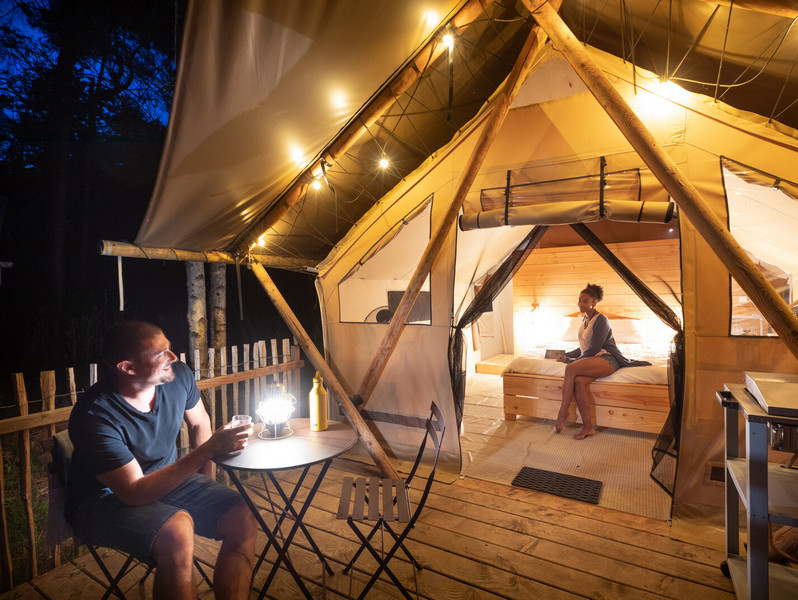 Ready-to-camp wood and canvas tents for a unique outdoor getaway